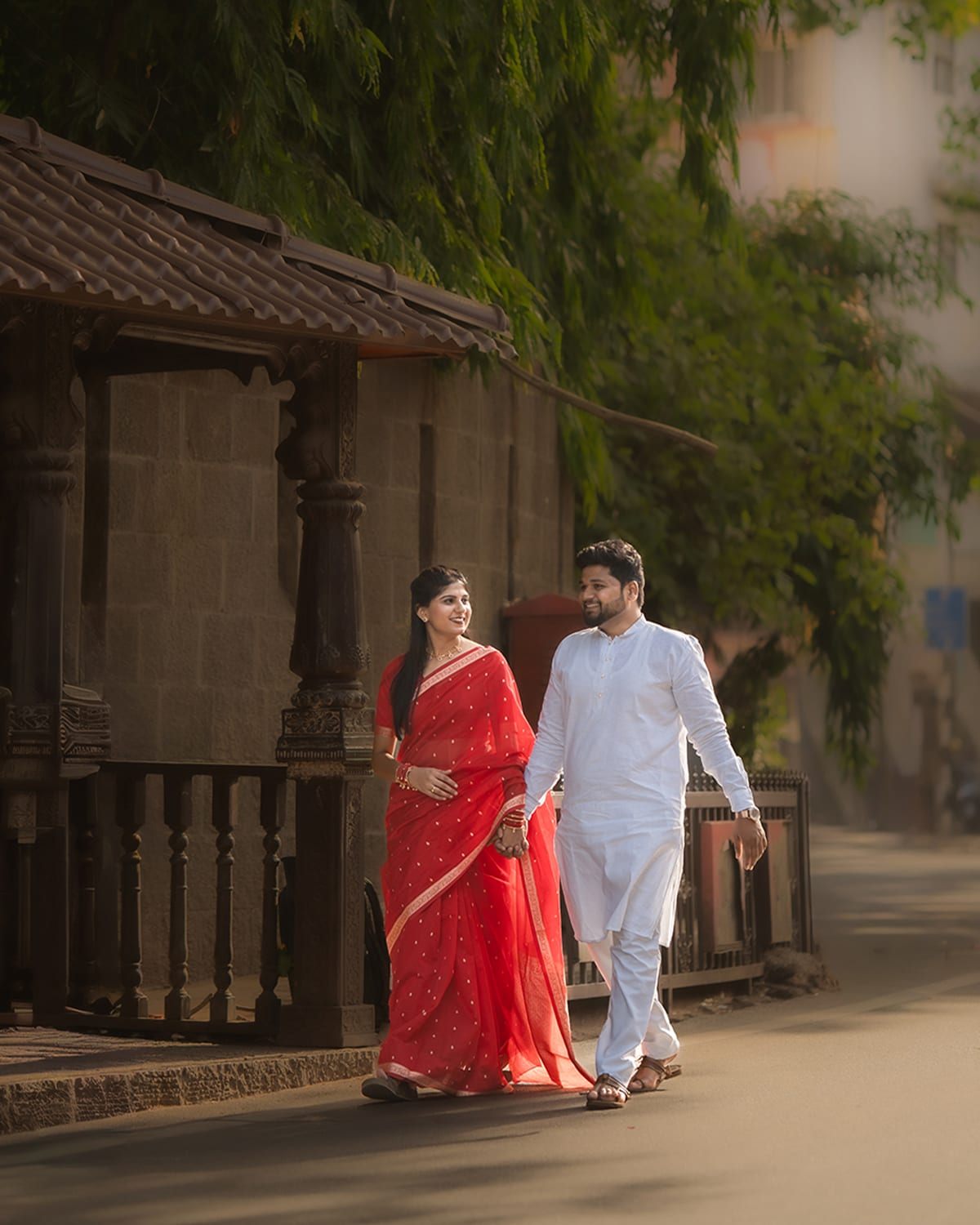 Pre-wedding couple frame on location, vertical