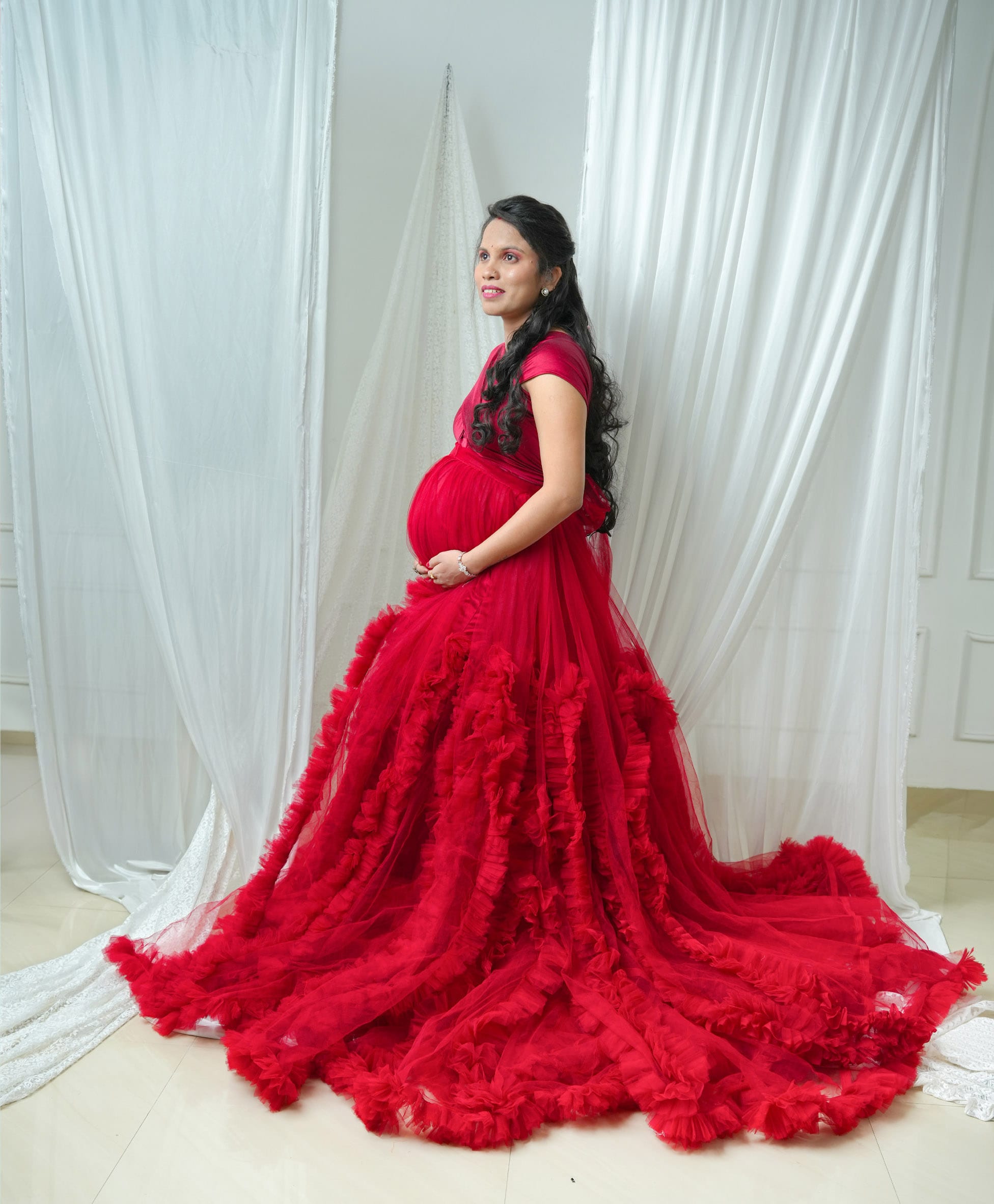 Maternity portrait in soft natural light, vertical